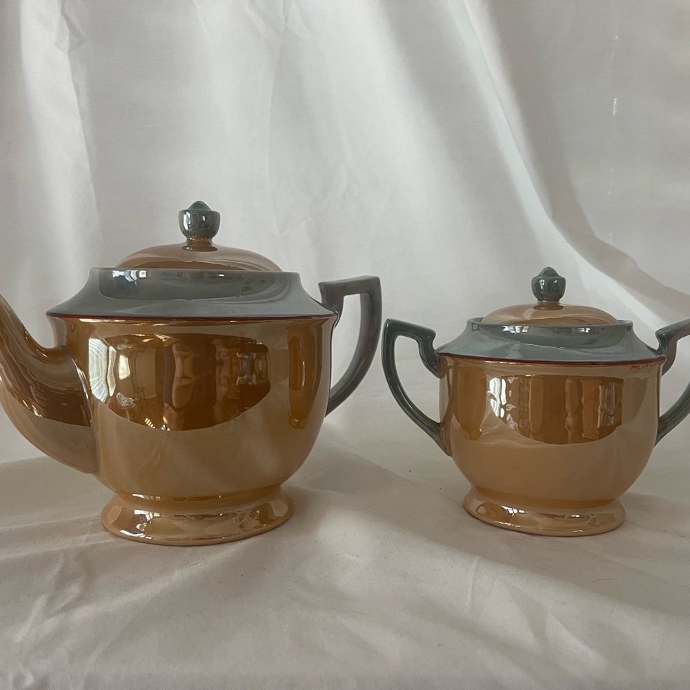 Gorgeous iridescent vintage orange and aqua  teapot and sugar bowl.
